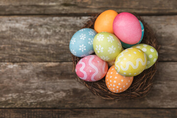 Easter eggs on a bright background. Easter celebration concept. Colorful easter handmade decorated Easter eggs. Place for text. Copy space.