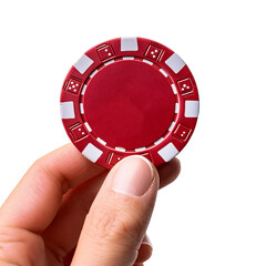 A close-up of a hand holding a red poker chip, symbolizing casino gaming and chance.