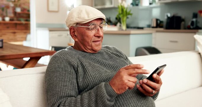 Notification, phone and smile with senior man on sofa in living room of home for retirement fund update. Alert, app and swipe with happy elderly person in living room for mobile pension planning