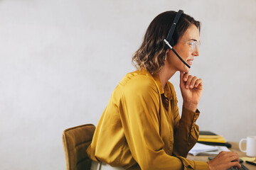 Contact center employee managing call operations with expertise