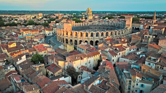Panorama of ancient town Arles in Provence and Cote d'Azur, France, South Europe. Aerial view of Ancient, 2-tiered Roman gladiatorial amphitheatre hosting bullfighting and community events.