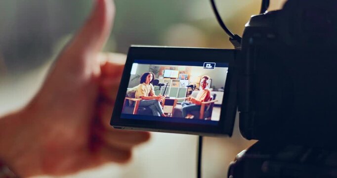Video, camera and live recording with thumbs up for interview, podcast or talk show at the studio. Closeup, hands and like emoji for online vlog or broadcast with journalist, host and guest speaker