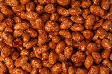 Tasty sweet roasted peanuts as a background.