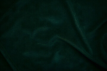 Dark green velvet. Textured green paper background texture.