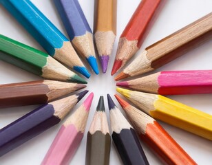 Fototapeta premium colored Wooden crayons in different colors lie in a circle, colored faces point to each other