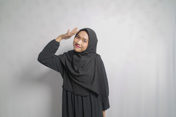 Young Woman in Black Hijab with Hand Raised