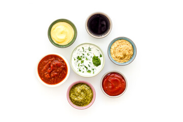 Bowls with various sauces for the meat or vegetables. Food background