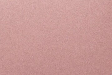 Recycled craft paper textured background in light pink old rose color