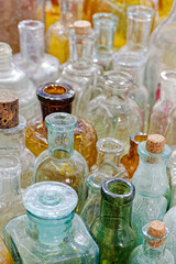 Big group of small empty glass bottles, aged and dusty