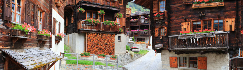 Most beautiful Swiss villages - pretty Griementz with traditional wooden houses and floral streets. popular tourist attraction in Valais Canton of Switzerland