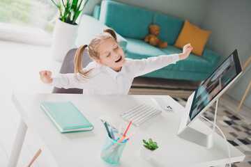 Obraz premium Photo portrait of cute adorable girl stretching sleepy have rest online computer remote lesson education from home indoors