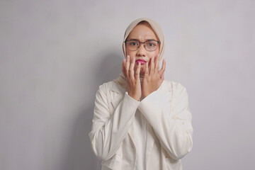 Woman in White Blazer and Hijab with Worried Expression