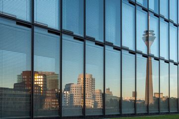 Reflection of skyscrapers and the Rhine Tower in the city of Dusseldorf