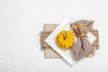 Autumn table setting. Thanksgiving cutlery, traditional fall decor. Cozy mood, minimalist design