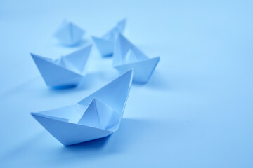 paper boats on the paper background