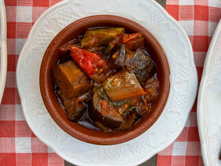 Traditional French dish ratatouille with steamed vegetables in a plate high angle view