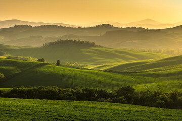Spectacular landscapes of Val di Orcia in Tuscany, taken during sunset. Spring is the best time to visit this region.