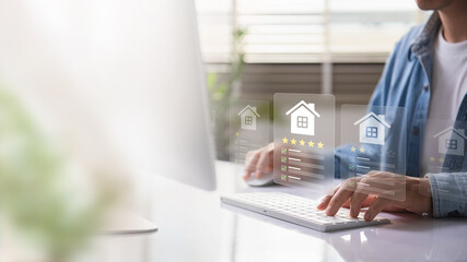 A person reviewing digital real estate listings with star ratings, showcasing online property...