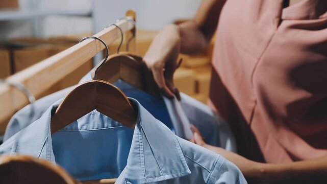 Designer concept.The dressmaker is designing an evening dress in the room.Asian clothing designers are measuring sample sizes to prepare evening gowns for important customer orders