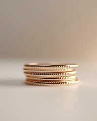 A clean 3D model of a stack of gold coins with a simple, reflective texture, placed neatly on a flat surface