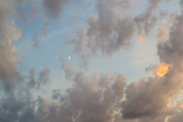 Cumulus clouds illuminated by the rays of sunset