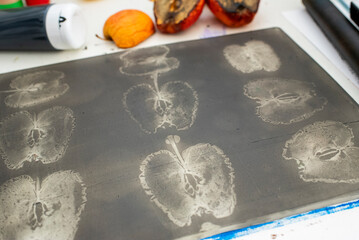 A gel printing plate onto which apple stamps have been applied with acrylic paint. Ready for a...