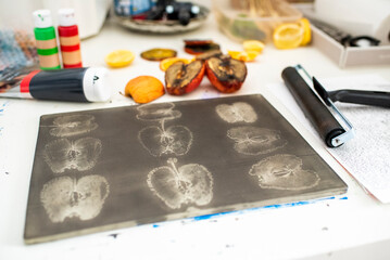 A gel printing plate onto which apple stamps have been applied with acrylic paint. Ready for a...