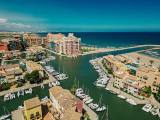 Colorful houses, buildings and yachts in Port Saplaya, Valencia's Little Venice.