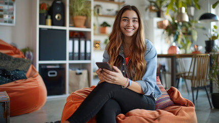 Obraz premium A happy professional woman working in her home office, surrounded by plants and creative materials.
