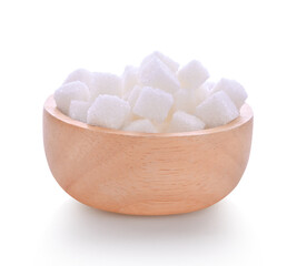 White sugar cubes in wooden bowl isolated on white background