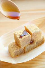 Delectable Japanese Confection Called Warabimochi, Being Poured on Top with Kuromitsu syrup