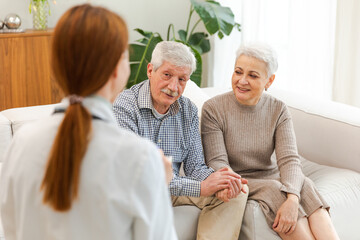 Female doctor examining older senior couple in doctor office or at home. Old woman man patient and doctor have consultation in hospital room. Medicine healthcare medical checkup. Visit to doctor