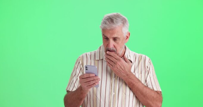 Green screen, surprise and senior man with phone in studio for online news, voting and announcement. Shocked, emoji and person with tech on mockup space for elections, campaign and digital results