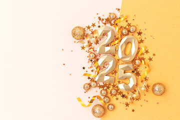 2025 New Year concept. Golden numbers and confetti on a beige background.