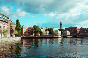 Buildings by the river during summer