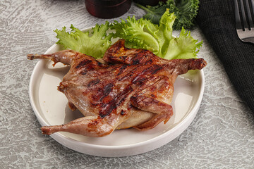 Grilled quail in the plate