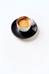 Cup of coffee on bright wooden background. Soft focus. Close up. Copy space.	