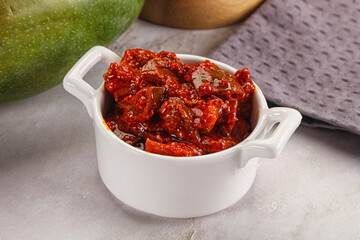 Spicy pickled raw green mango