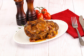 Italian cuisine - ossobuco with sauce