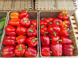 choosing tomatoes at the grocery store