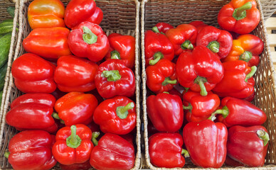 choosing tomatoes at the grocery store