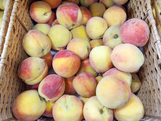 buying apricots, peaches,various fruits on supermarket shelves
