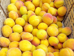 buying apricots, peaches,various fruits on supermarket shelves