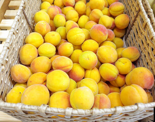 buying apricots, peaches,various fruits on supermarket shelves