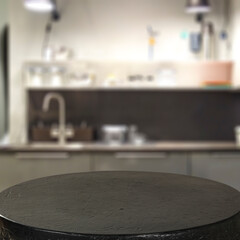 Empty table with copy space for products and blurred kitchen with nostalgic natural daily light background.