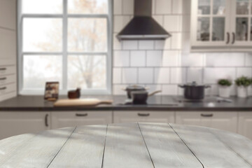 Empty table with copy space for products and blurred kitchen with nostalgic natural daily light background.
