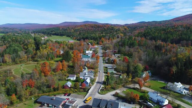 Flying Over Classic White Church and Steeple in New England - East Burke, Vermont