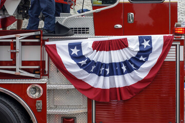 close-up of fire truck with red, white and blue banner