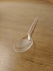 plastic spoon in wood table