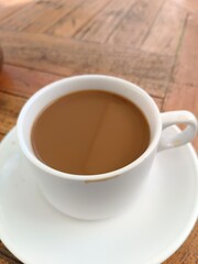 cup of coffee on wooden table